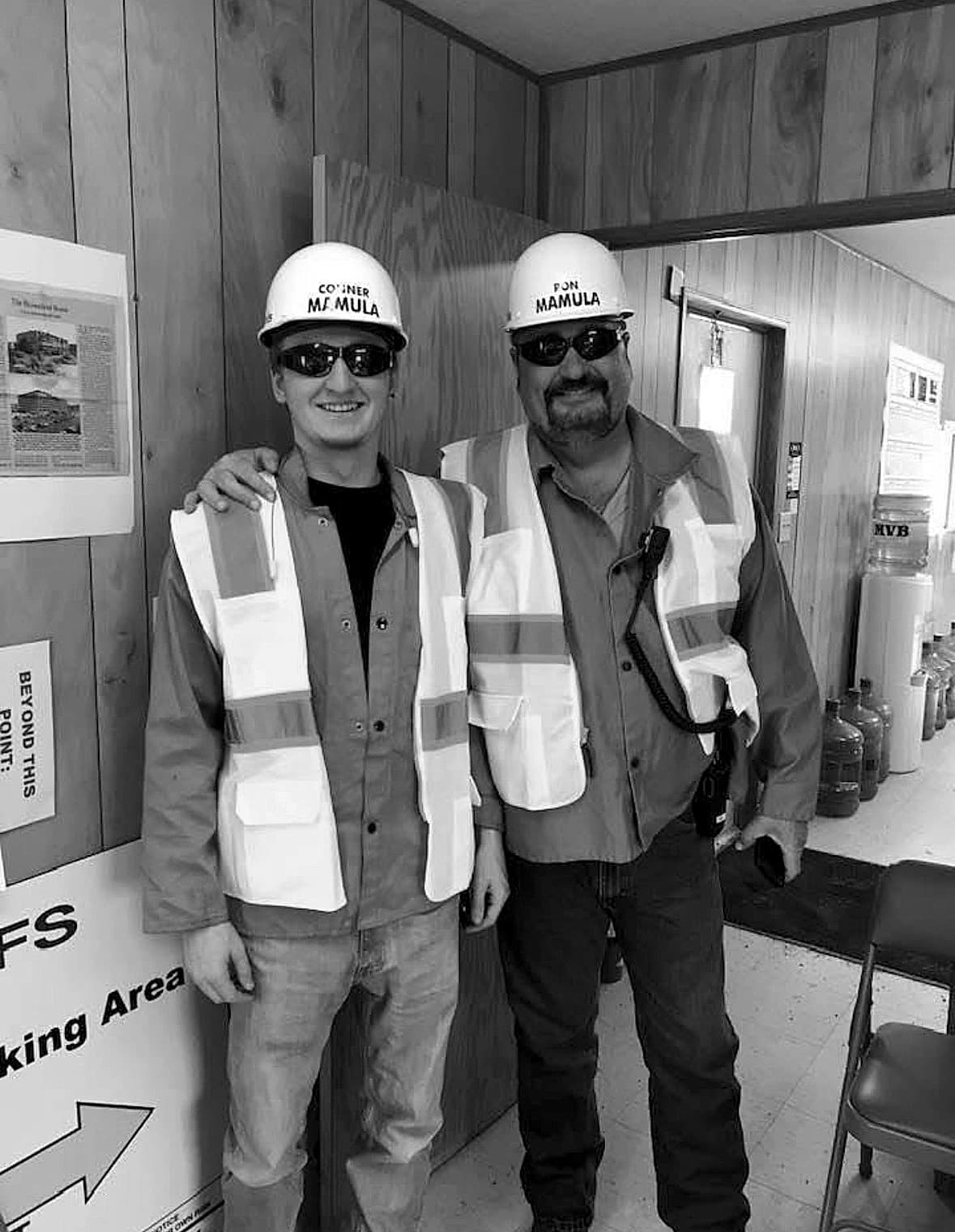 Conner Mamula with his father on a job site