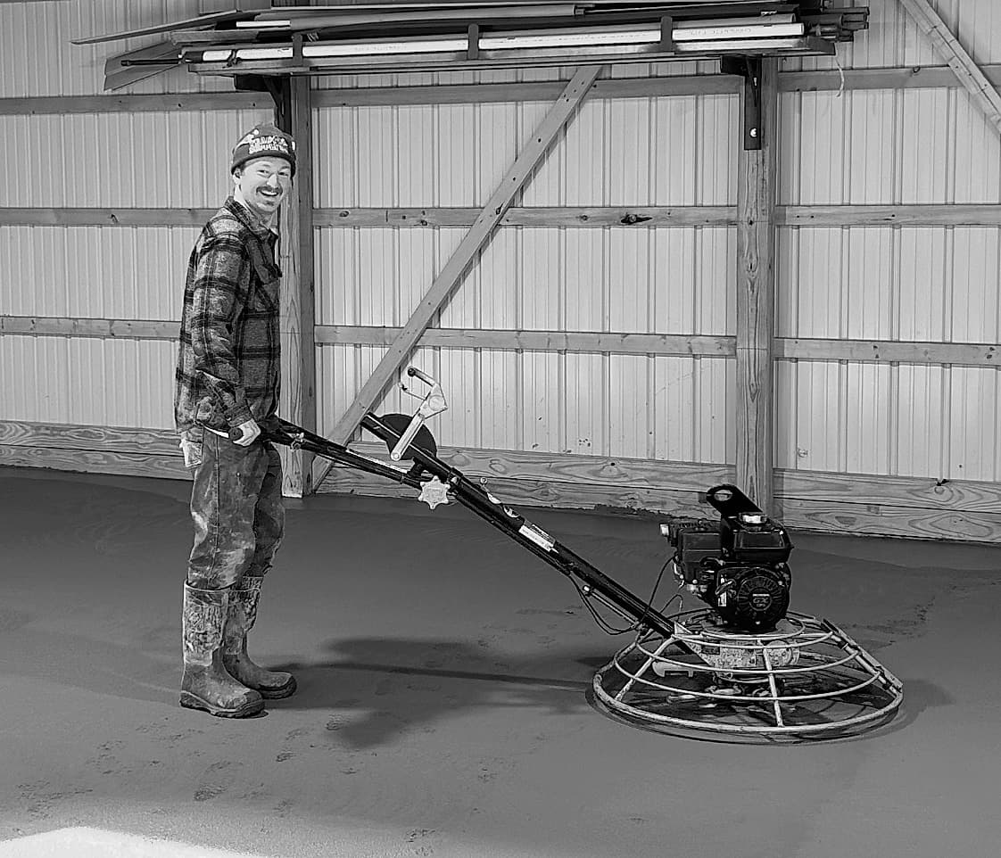 Conner Mamula finishing a concrete floor