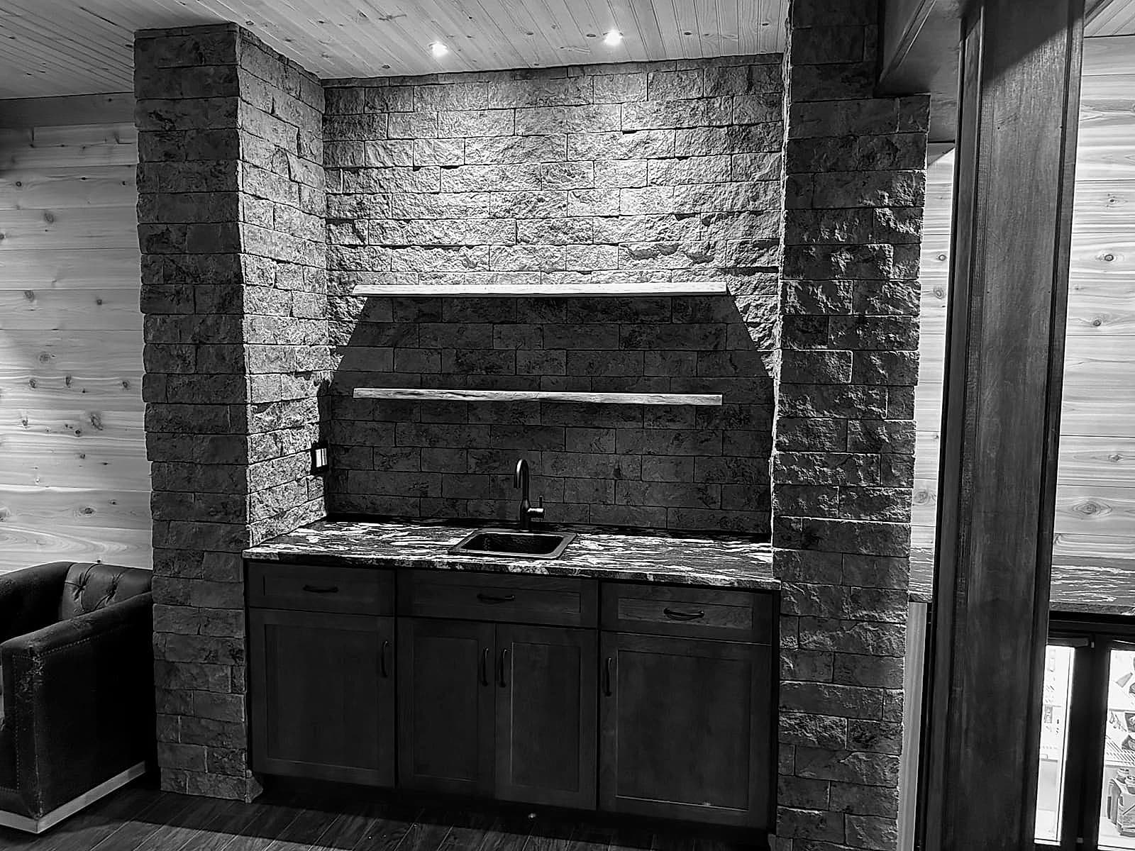 A custom basement bar built by CMM Contracting Solutions