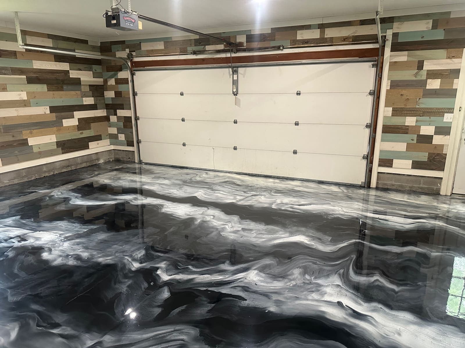 after photo of the Metallic epoxy garage floor