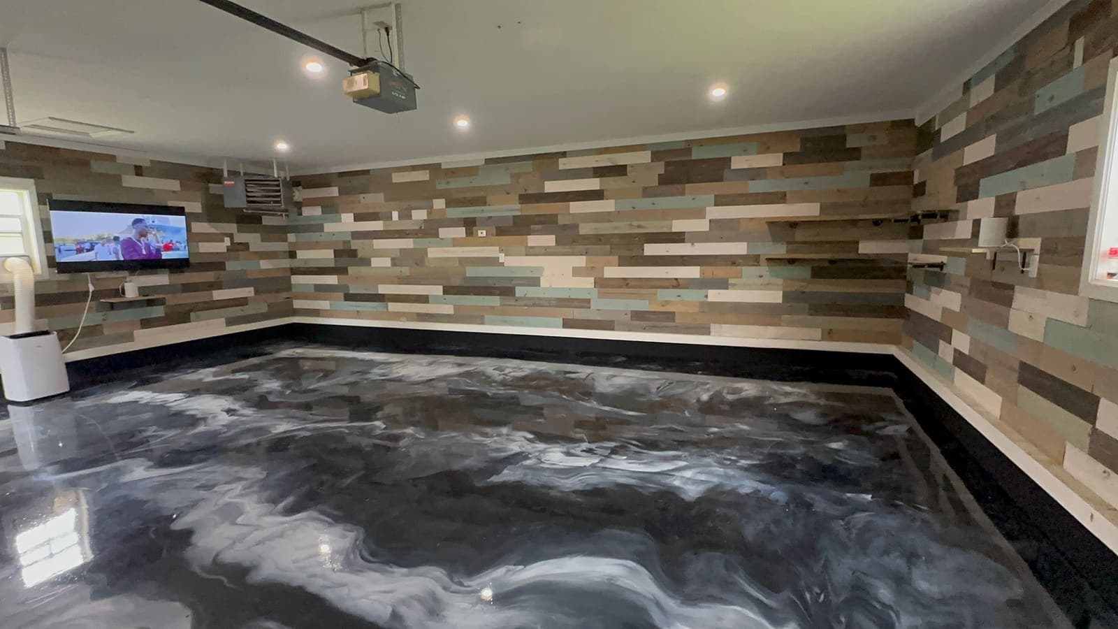 after photo of the Metallic epoxy garage floor