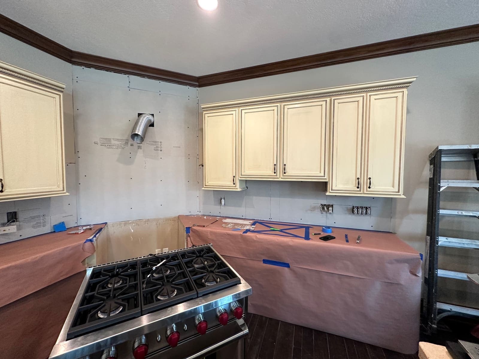 during photo of the Kitchen range hood and backsplash remodel